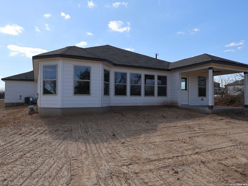 Exterior details and patio area of a home in Chaparral Ranch, Floresville (Image 3).