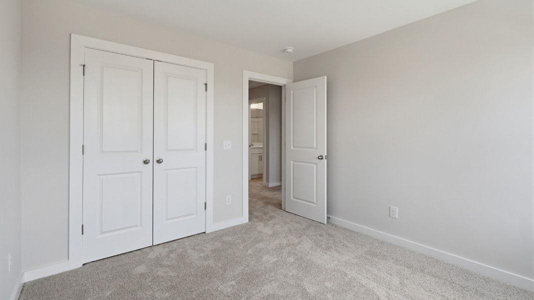 Secondary bedroom with double door closet for storage options