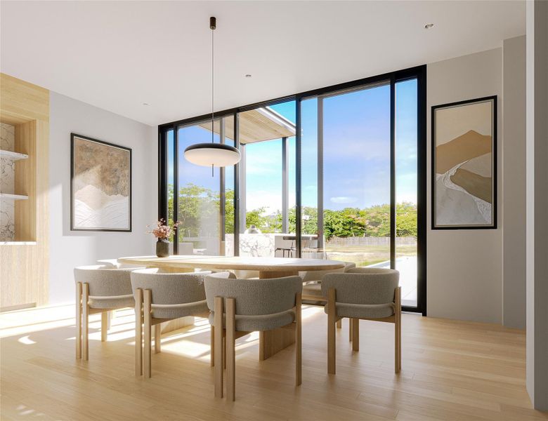 Elegant dining area located with view to back patio outdoor kitchen area (rendering)
