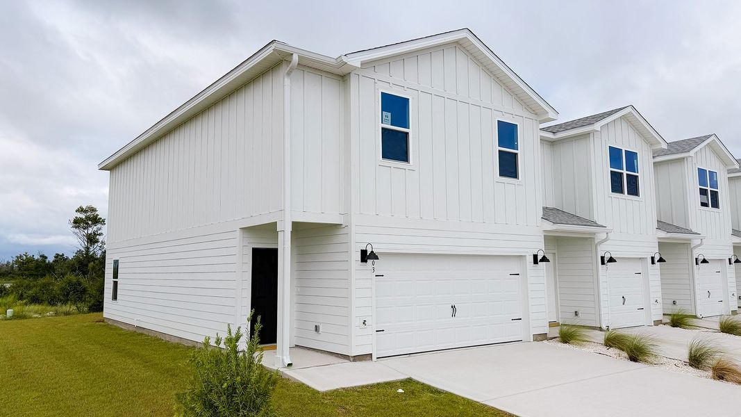 Front exterior of a new home in Salt Creek Townhomes at Mexico Beach, Mexico Beach, FL, highlighting curb appeal (Image 16).