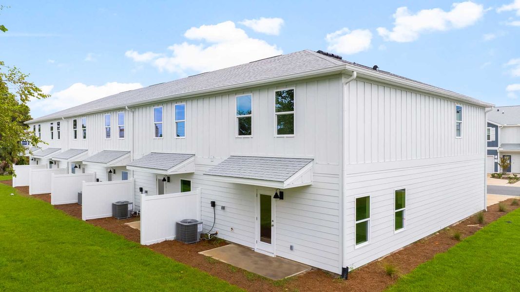 Representative exterior photo of a completed home built from the Palm Exterior by D.R. Horton in Caballeros Estates Townhomes at Hombre, Panama City Beach, FL (Image 22). Representative exterior photo of a completed home built from the Palm Exterior by D.R. Horton in Caballeros Estates Townhomes at Hombre, Panama City Beach, FL (Image 22).