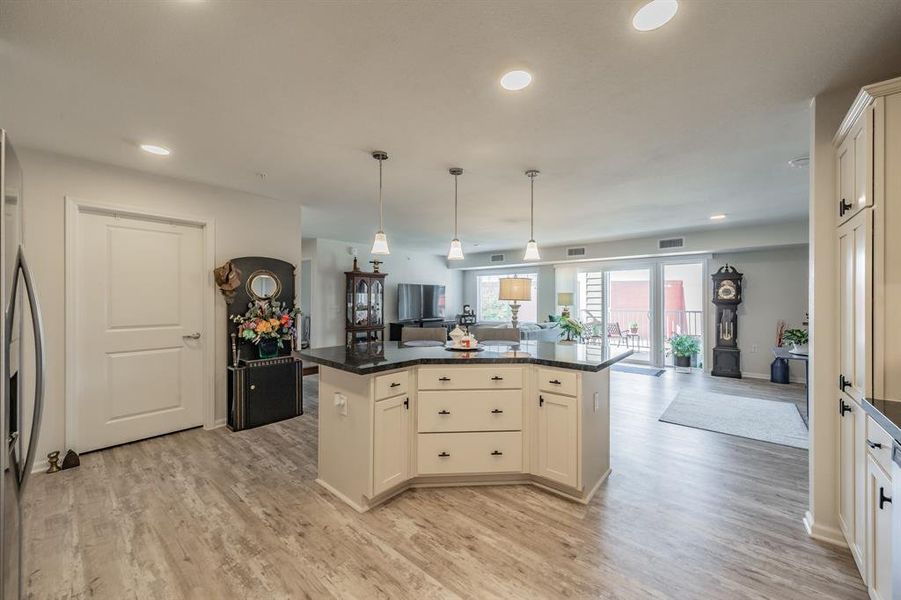 Kitchen island looking back into living room space creating a warm flow.