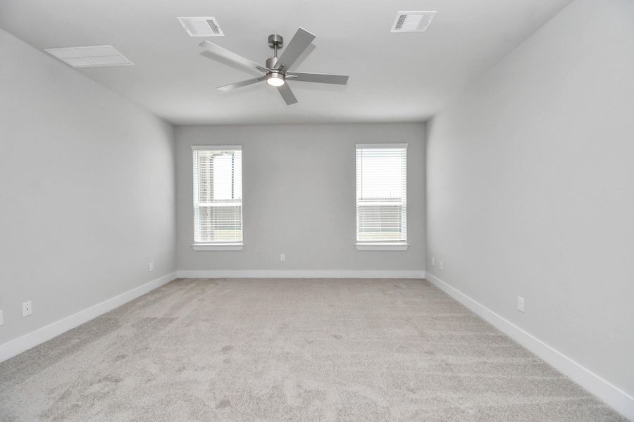 Another perspective unveils a comprehensive view of the serenity and comfort this primary suite offers. Sample photo of completed home with similar floor plan. Actual colors and selections may vary. Another perspective unveils a comprehensive view of the serenity and comfort this primary suite offers. Sample photo of completed home with similar floor plan. Actual colors and selections may vary.