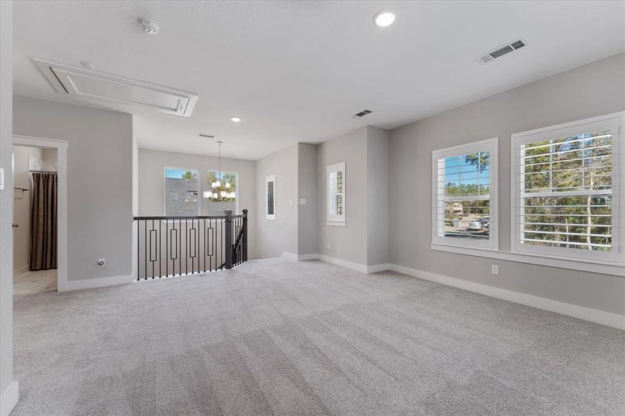 large game room with tons of windows for natural lighting!