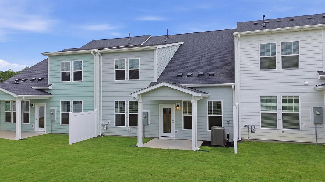 Exclusive rear covered porch with accomplished detail and elevated outdoor living potential at Village at Midway Exclusive rear covered porch with accomplished detail and elevated outdoor living potential at Village at Midway