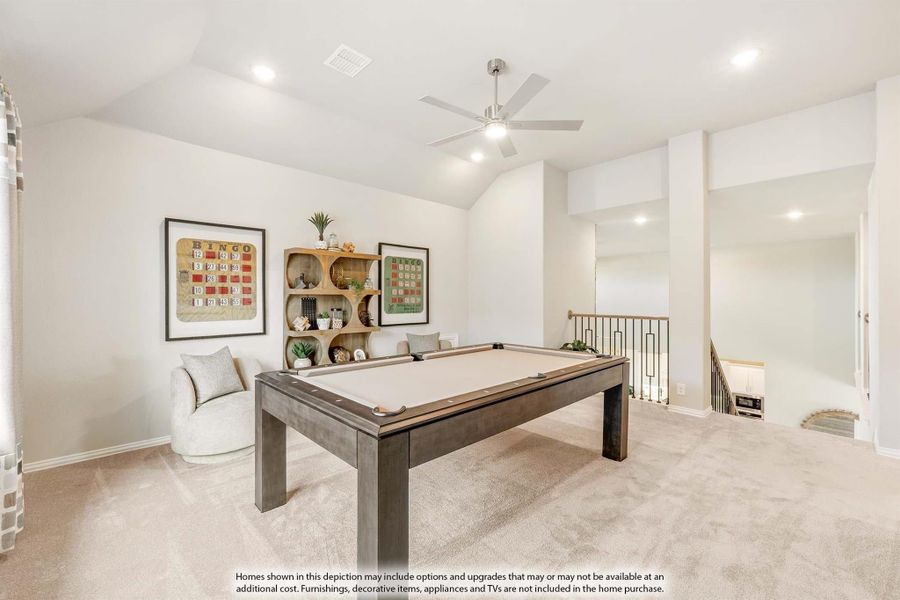 Game room with pool table, vaulted ceiling, ceiling fan, and carpet flooring near staircase landing Game room with pool table, vaulted ceiling, ceiling fan, and carpet flooring near staircase landing