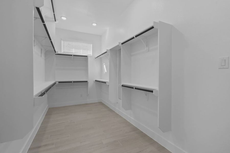 Representative unfurnished interior of a home built from the Waterford by Chesmar Homes in Meridiana 60's, Manvel (Image 22).