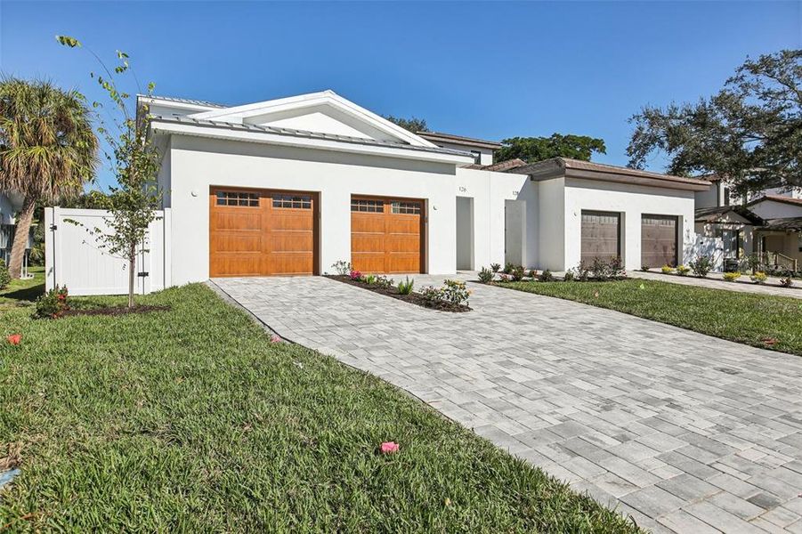 Front exterior of a new home in , St. Petersburg, FL, highlighting curb appeal (Image 1). Front exterior of a new home in , St. Petersburg, FL, highlighting curb appeal (Image 1).