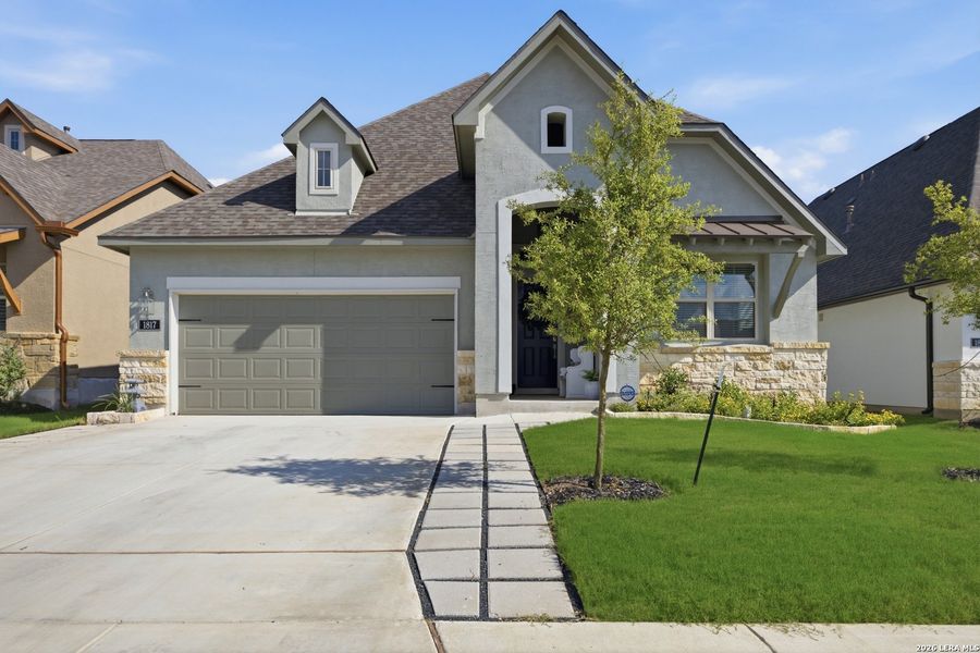 Front exterior of a new home in Ventana, Bulverde, TX, highlighting curb appeal (Image 24).