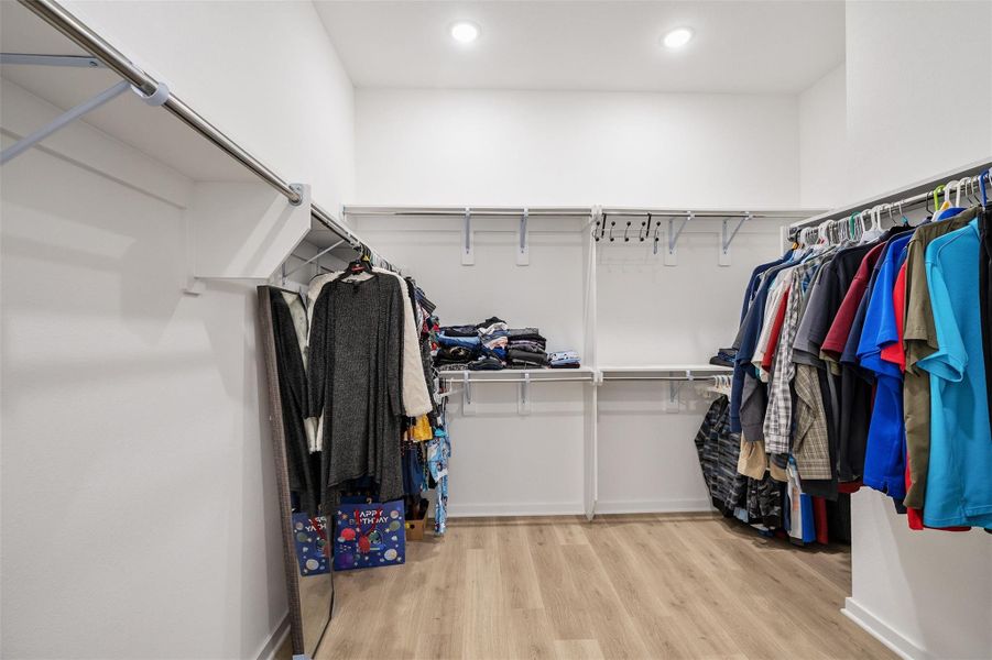 Say goodbye to storage problems with this massive primary closet featuring abundant hanging space, built in shelving, and room to keep everything beautifully organized. Designed with both function and convenience in mind, this oversized walk in is a true luxury feature.