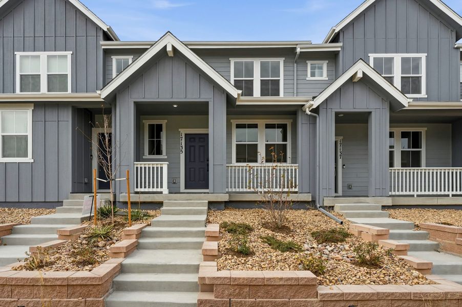 Front exterior of a new home in Trailstone Townhomes - The Westerly Collection, Arvada, CO, highlighting curb appeal (Image 1).