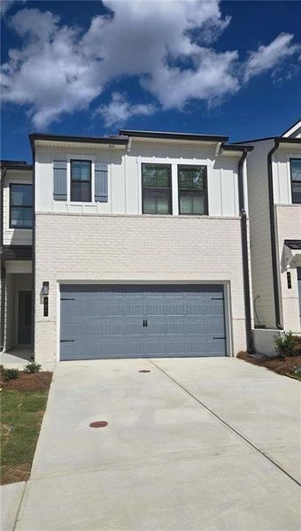 Front exterior of a new home in Azalea Square Townhomes, Lawrenceville, GA, highlighting curb appeal (Image 25).