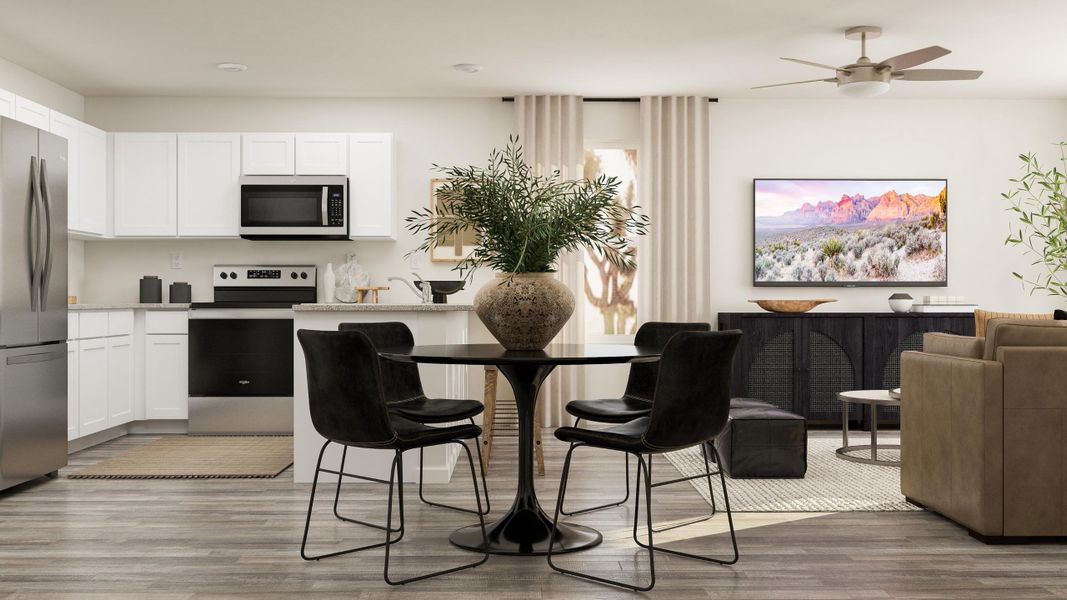 A living room with a table and chairs.