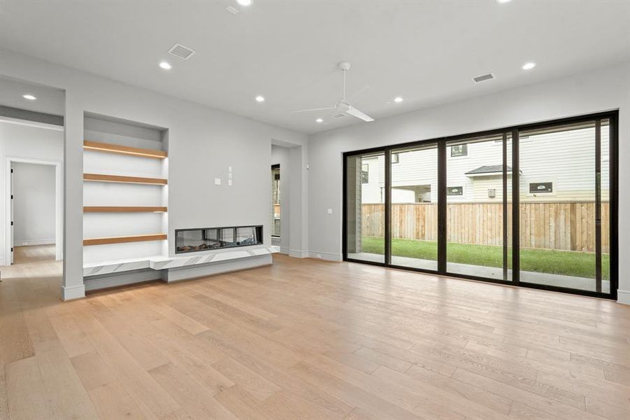 The living room enjoys tons of natural light and a gorgeous fireplace!