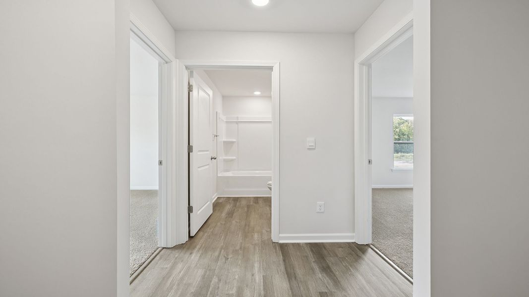 Spacious, unfurnished interior of a new home in Bentley Park, Greenwood (Image 12).