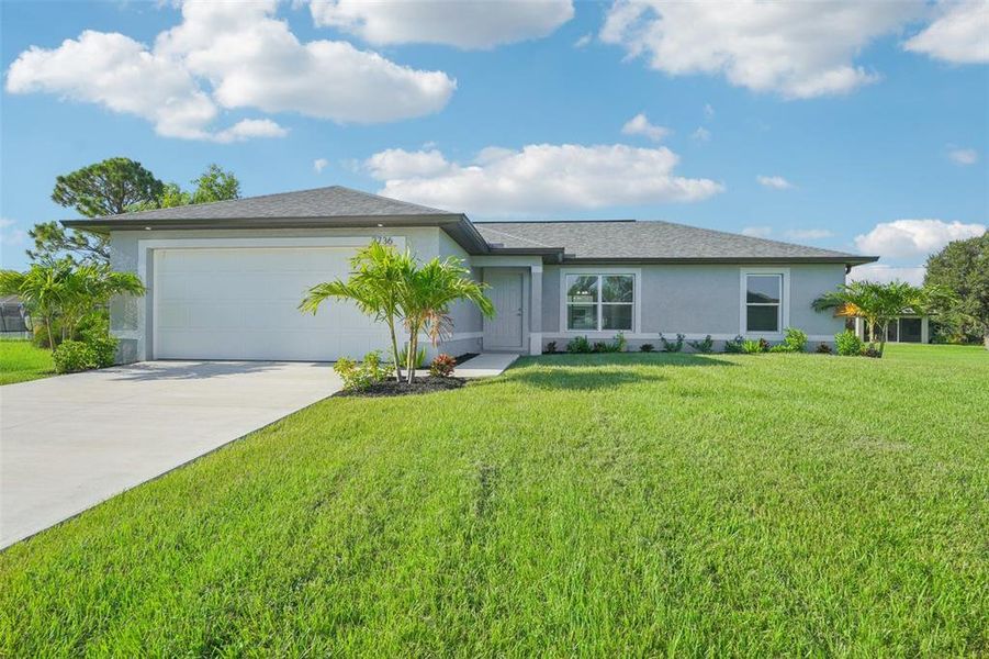 Front exterior of a new home in , Punta Gorda, FL, highlighting curb appeal (Image 1). Front exterior of a new home in , Punta Gorda, FL, highlighting curb appeal (Image 1).
