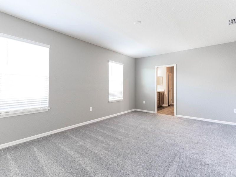 Your spacious owner`s suite is conveniently located downstairs - Wayfair III by Highland Homes Your spacious owner`s suite is conveniently located downstairs - Wayfair III by Highland Homes