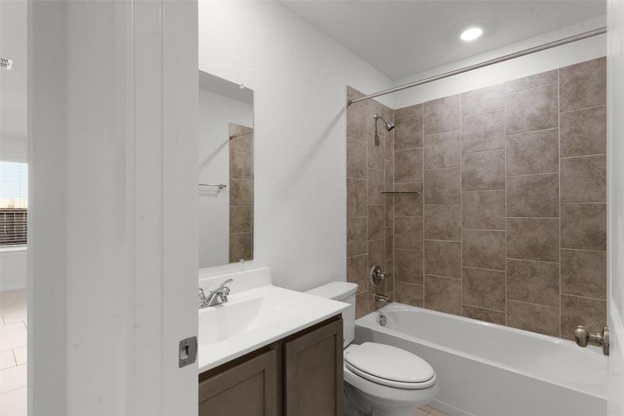 Full bath with vanity and bathtub / shower combination
