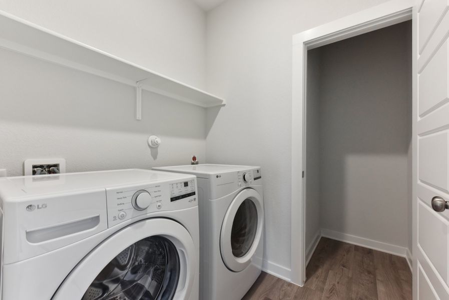 A washing machine in a room. A washing machine in a room.