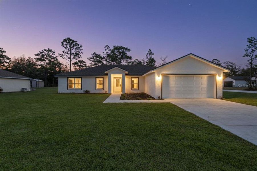 Front exterior of a new home in , Weeki Wachee, FL, highlighting curb appeal (Image 27).