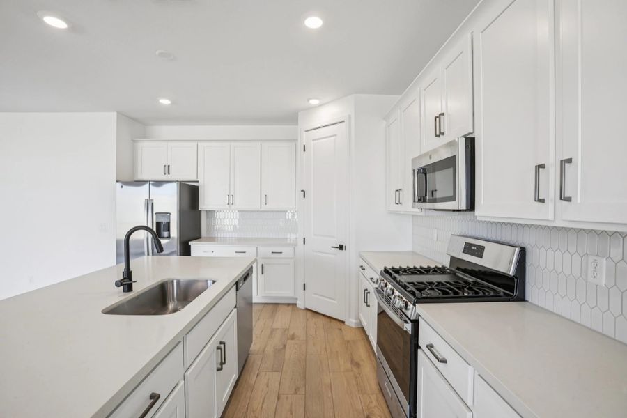Kitchen featuring the Harmony Collection. Not actual home, finishes may vary by community. Kitchen featuring the Harmony Collection. Not actual home, finishes may vary by community.