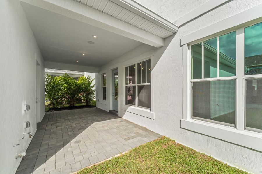 Exterior details and patio area of a home in Newfield - Rosette Park, Palm City (Image 3).