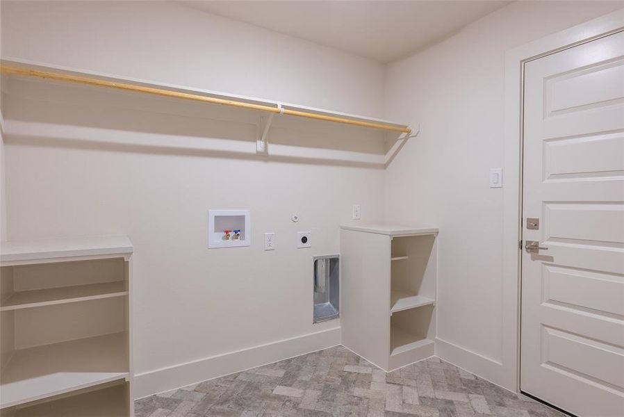 Laundry room with hookup for a washing machine, electric dryer hookup, and hookup for a gas dryer