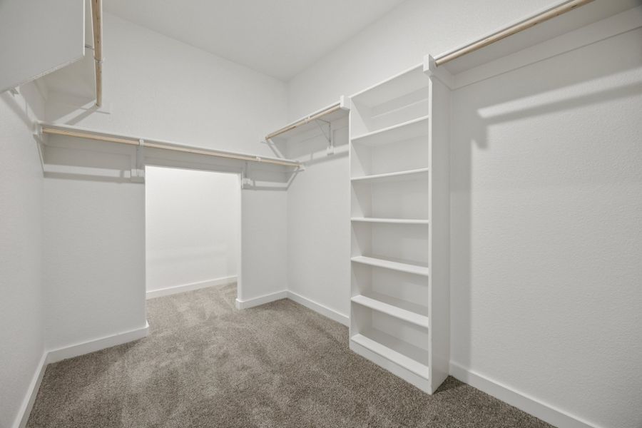 Primary Closet in the Haylee home plan by Trophy Signature Homes - REPRESENTATIVE PHOTO Primary Closet in the Haylee home plan by Trophy Signature Homes - REPRESENTATIVE PHOTO