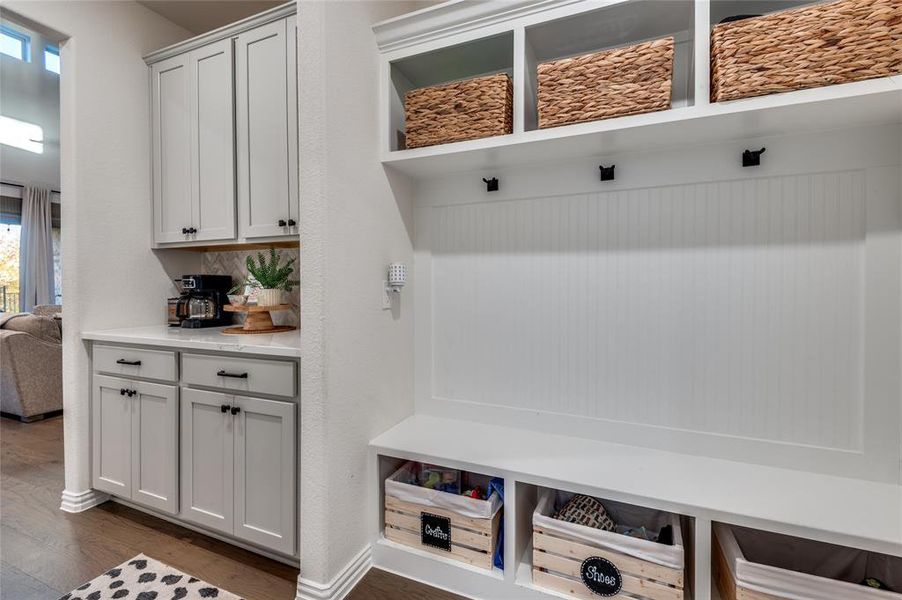 Mudroom featuring dark wood-type flooring