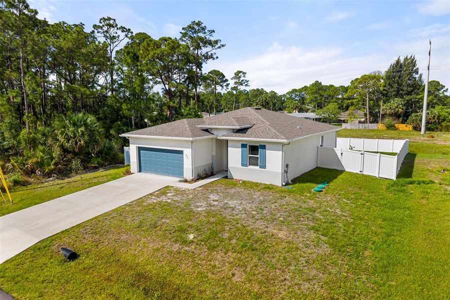 Front exterior of a new home in , Palm Bay, FL, highlighting curb appeal (Image 23).