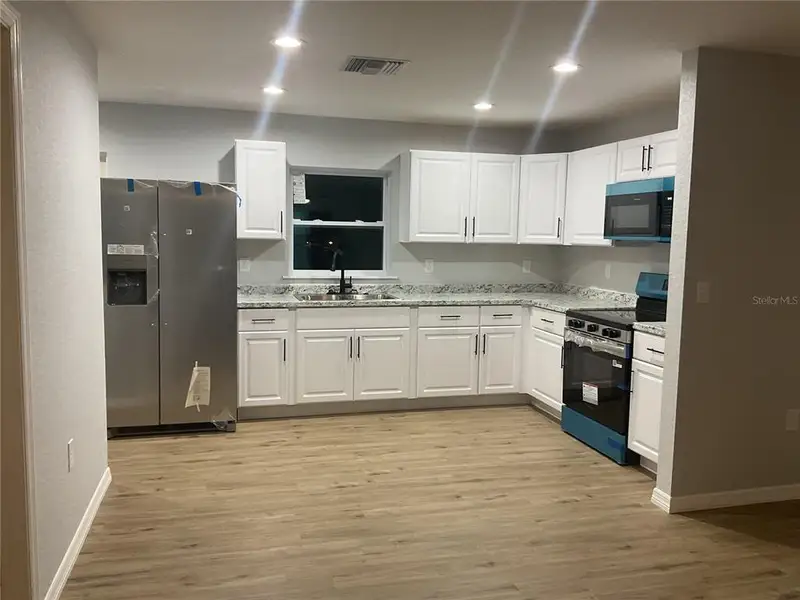 Furnished interior view inside a new home in , Okeechobee (Image 6).
