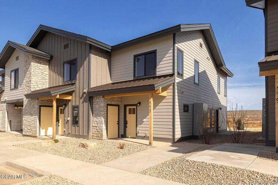 Front exterior of a new home in , Granby, CO, highlighting curb appeal (Image 1).
