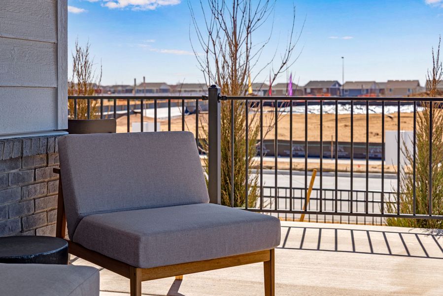 Exterior details and patio area of a home in Painted Prairie, Aurora (Image 21).