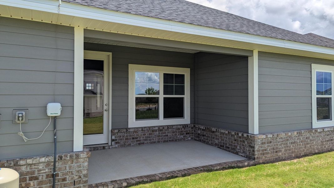 Exterior details and patio area of a home in The Bluffs at Lafayette, Freeport (Image 3).