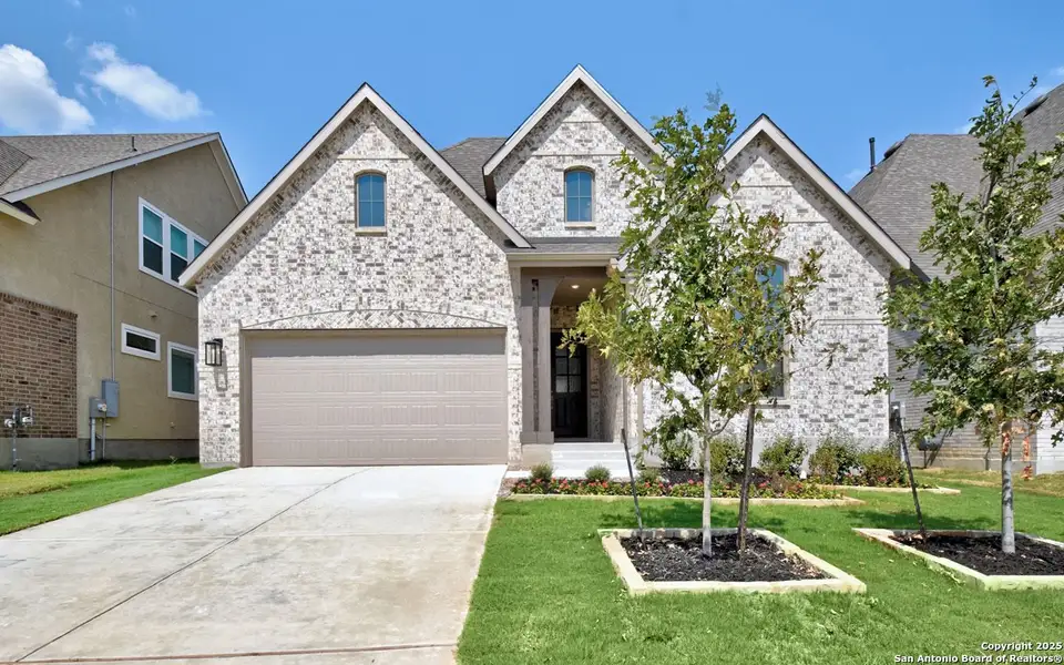 Front exterior of a new home in Davis Ranch: 50ft. lots, San Antonio, TX, highlighting curb appeal (Image 14). Front exterior of a new home in Davis Ranch: 50ft. lots, San Antonio, TX, highlighting curb appeal (Image 14).