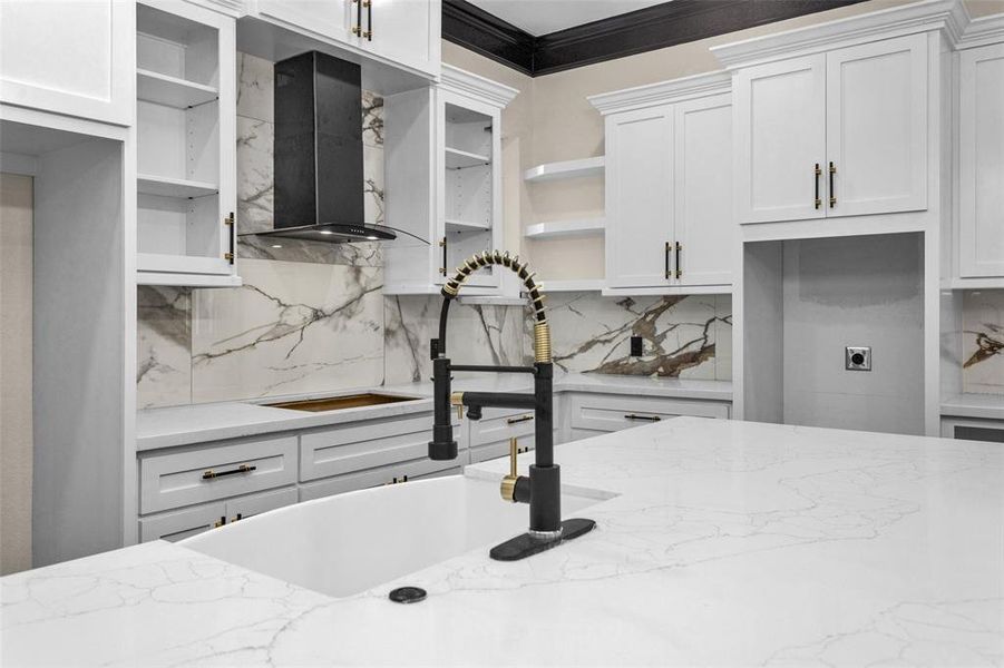 Look at these granite counters and easy to maintain marble style backsplash. And let's not miss the handle pulls and faucet.