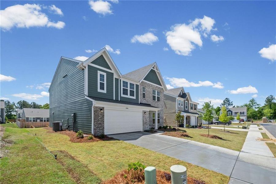 Front exterior of a new home in Cherry Glen, Euharlee, GA, highlighting curb appeal (Image 21). Front exterior of a new home in Cherry Glen, Euharlee, GA, highlighting curb appeal (Image 21).