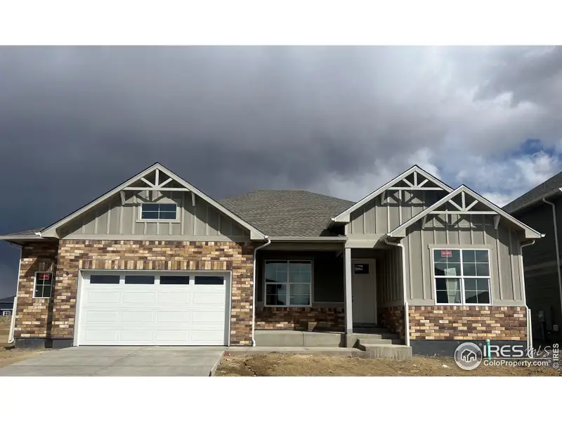 Front exterior of a new home in Vantage, Berthoud, CO, highlighting curb appeal (Image 1). Front exterior of a new home in Vantage, Berthoud, CO, highlighting curb appeal (Image 1).
