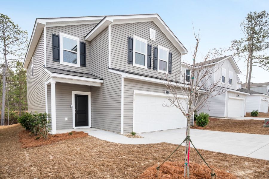Front exterior of a new home in Grand Arbor, Blythewood, SC, highlighting curb appeal (Image 19).