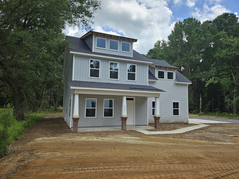 Front exterior of a new home in , Awendaw, SC, highlighting curb appeal (Image 12). Front exterior of a new home in , Awendaw, SC, highlighting curb appeal (Image 12).