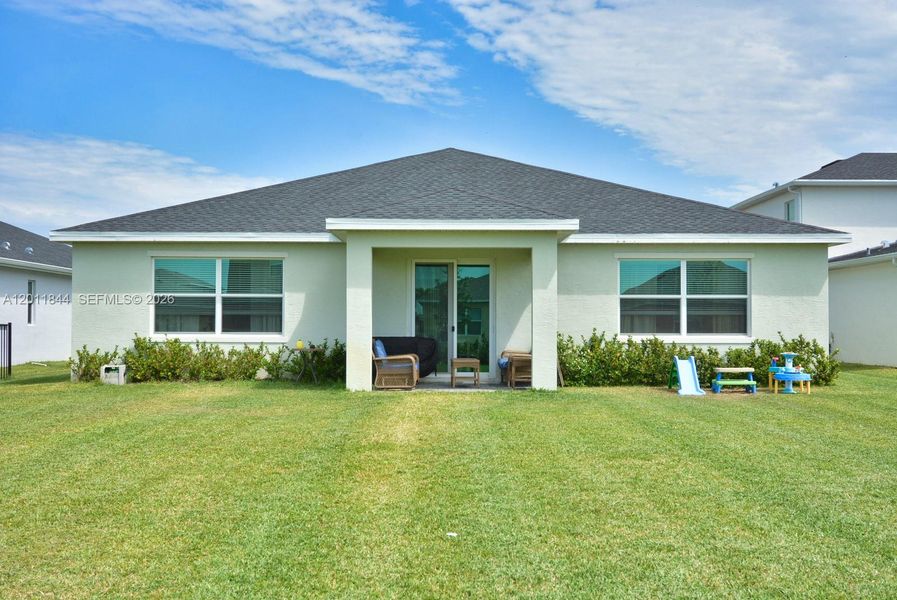 Exterior details and patio area of a home in Central Park, Port St. Lucie (Image 21).