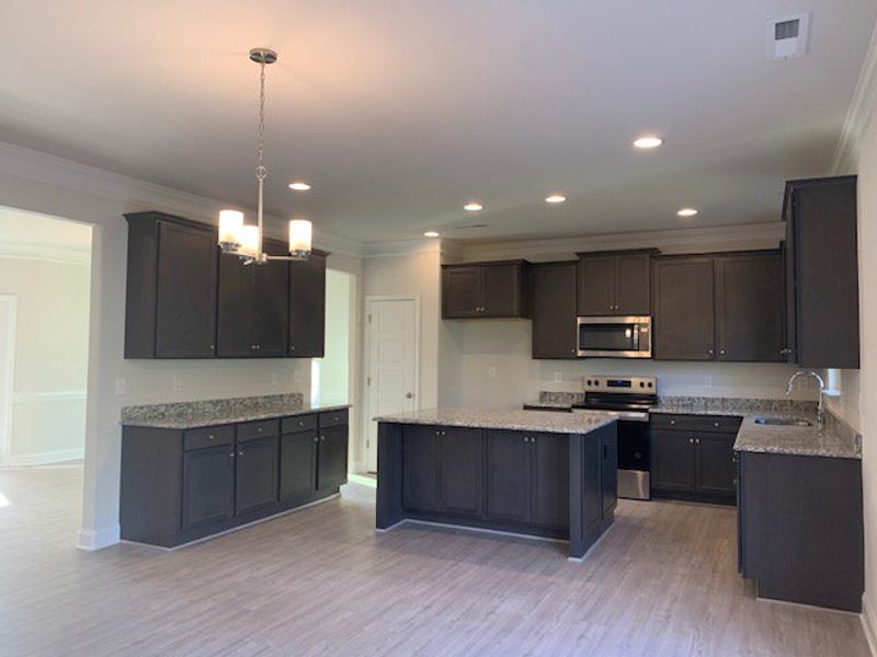 Furnished interior view inside a new home in Royal Pines, Trinity (Image 4).