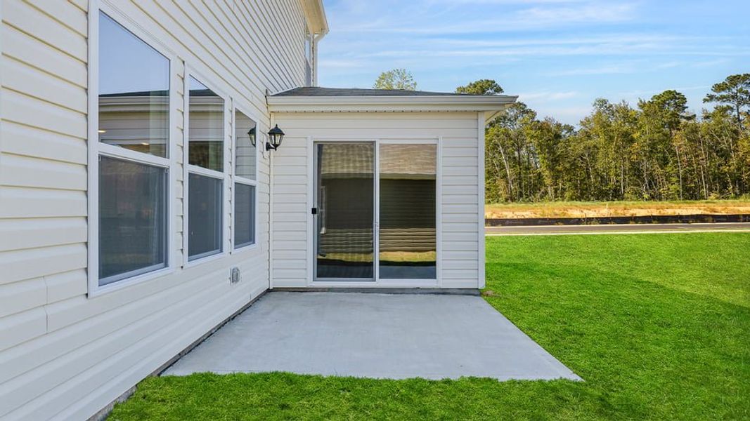 Exterior details and patio area of a home in Durbin Meadows, Fountain Inn (Image 19).