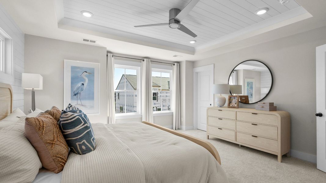 Owner's suite with walk-in closet & en suite bathroom in a DRB Homes Brookgreen model home