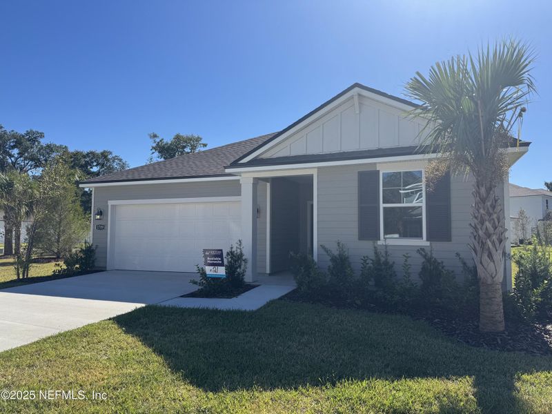 Front exterior of a new home in Oak Creek Preserve, Jacksonville, FL, highlighting curb appeal (Image 2). Front exterior of a new home in Oak Creek Preserve, Jacksonville, FL, highlighting curb appeal (Image 2).