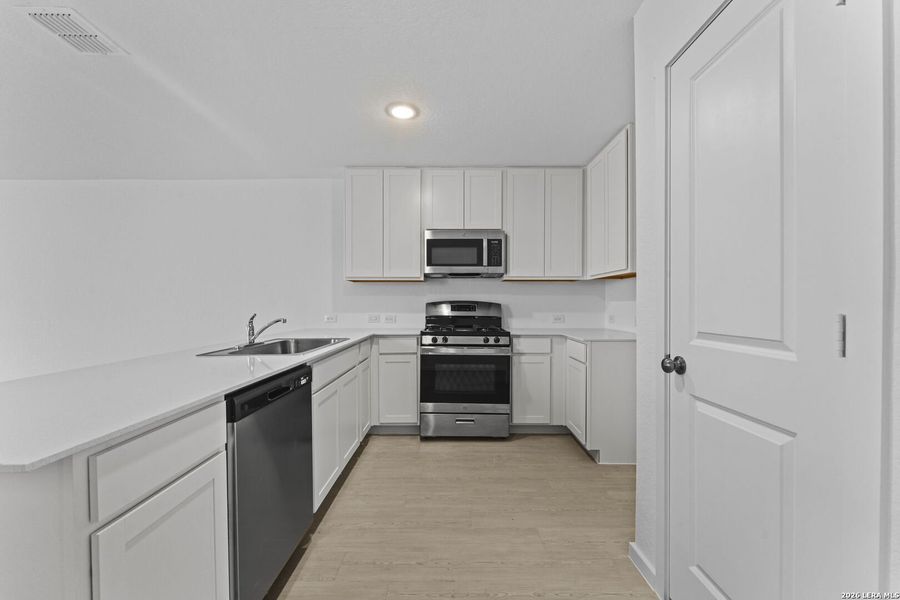 Furnished interior view inside a new home in Randolph Crossing: Cottage Collection, Converse (Image 6). Furnished interior view inside a new home in Randolph Crossing: Cottage Collection, Converse (Image 6).