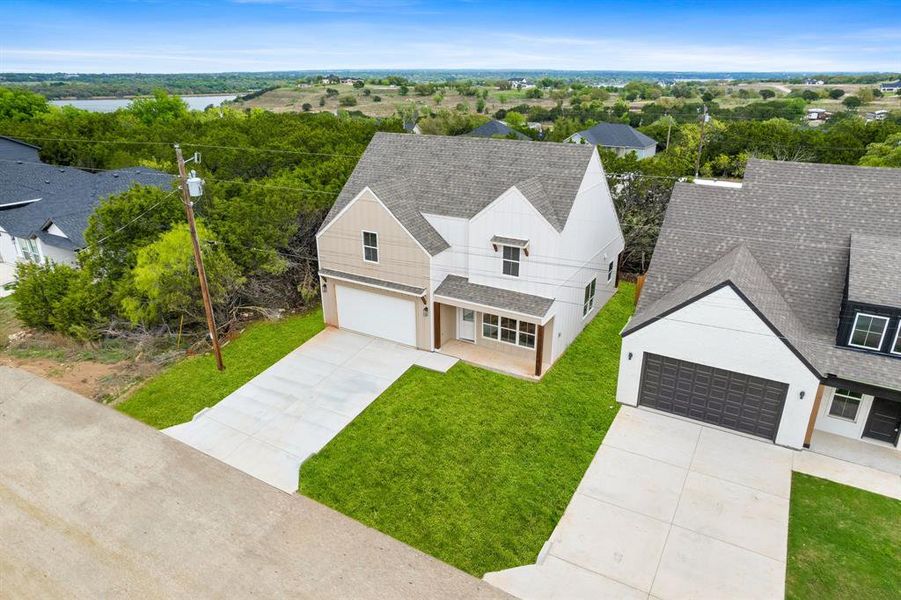 Front exterior of a new home in Canyon Creek, Granbury, TX, highlighting curb appeal (Image 21).