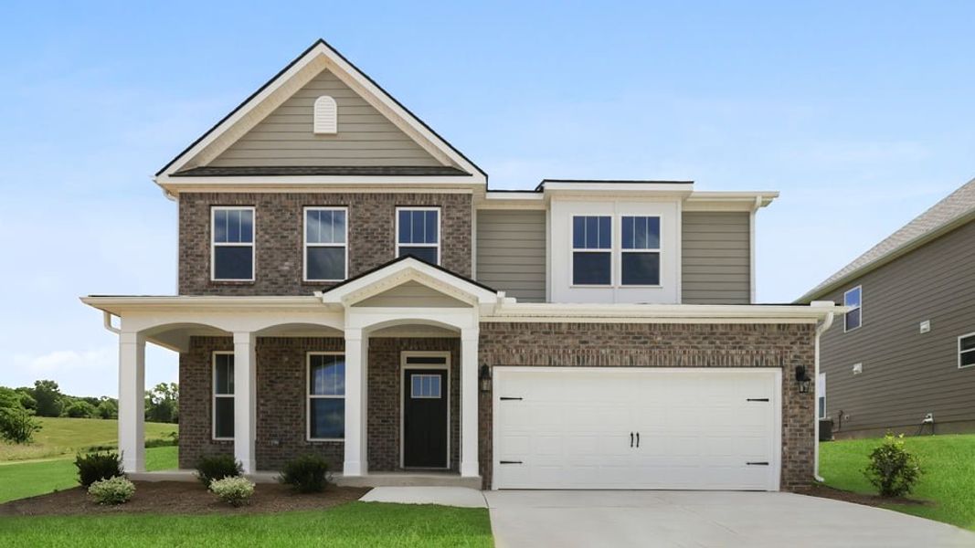 Front exterior of a new home in Adams Glen, Greenville, SC, highlighting curb appeal (Image 1). Front exterior of a new home in Adams Glen, Greenville, SC, highlighting curb appeal (Image 1).