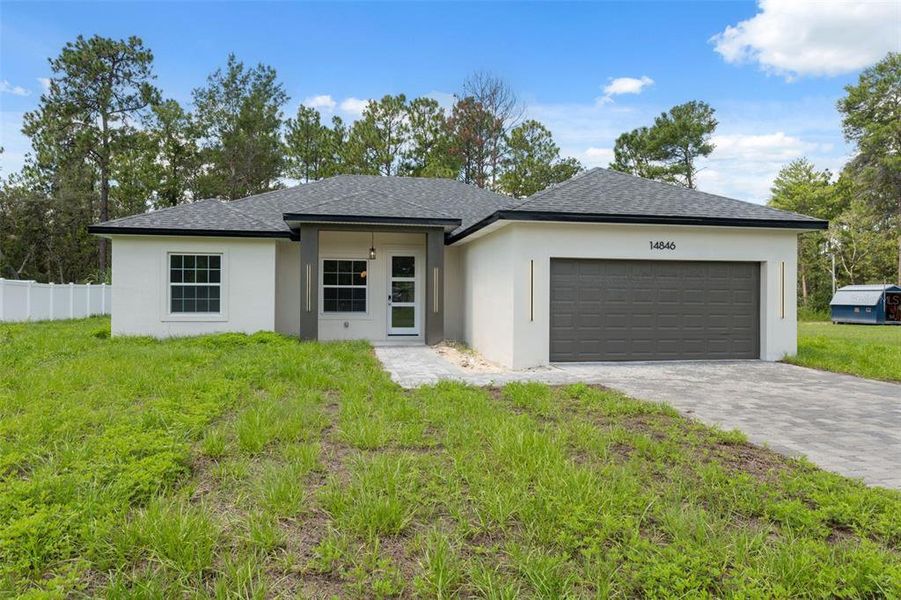 Front exterior of a new home in , Ocala, FL, highlighting curb appeal (Image 2).