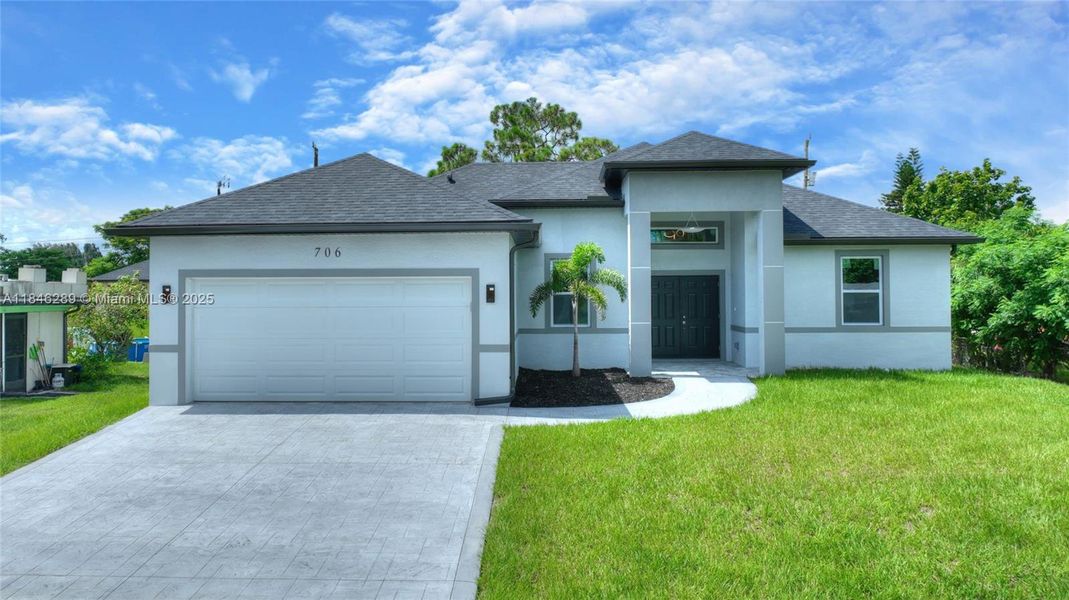 Front exterior of a new home in , Lehigh Acres, FL, highlighting curb appeal (Image 2). Front exterior of a new home in , Lehigh Acres, FL, highlighting curb appeal (Image 2).
